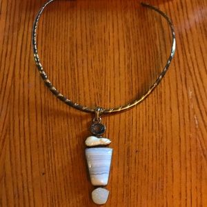 Silver choker with hanging blue pendant